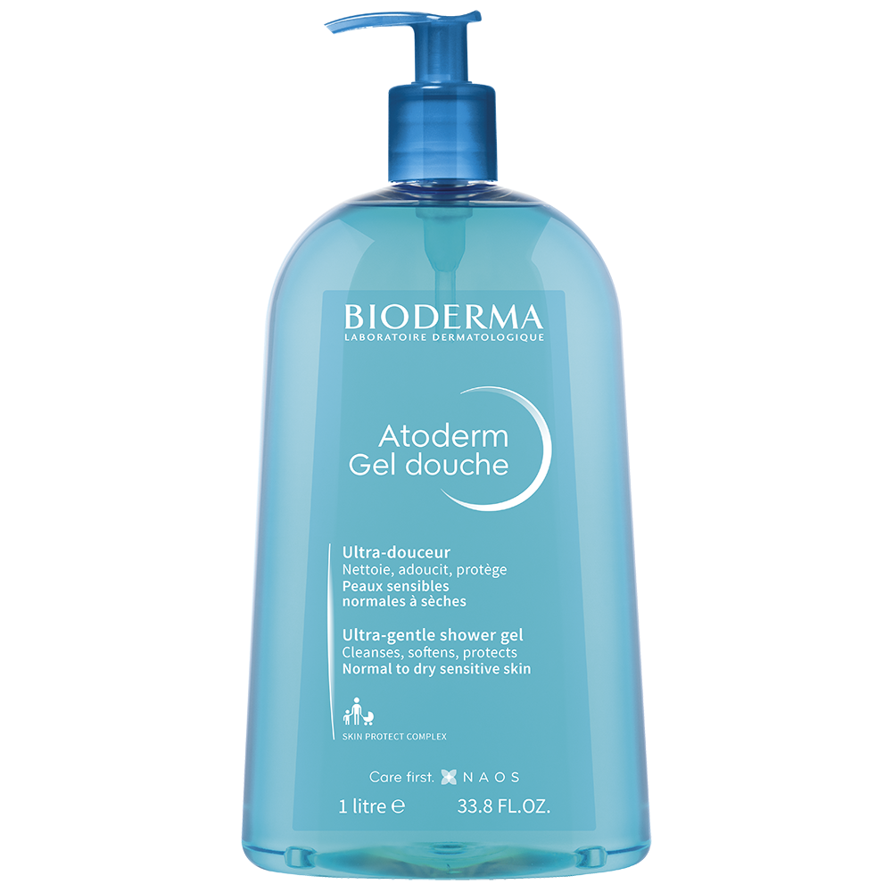 A clear plastic bottle with a blue label and pump dispenser, containing Bioderma Atoderm Shower Gel.