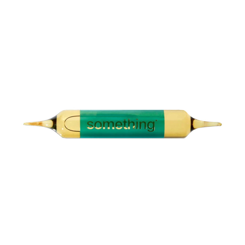 Ampoule with a. green label that says 'something'