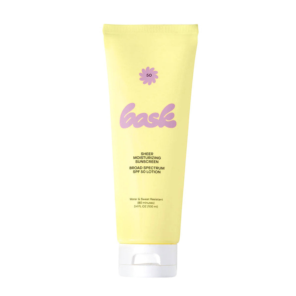 A yellow tube of Bask SPF 50 lotion with purple and white branding