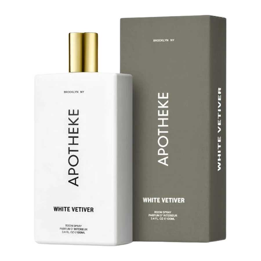 A product image featuring a White Vetiver room spray bottle with a gold cap next to its packaging box, both with the label 'APOTHEKE'.