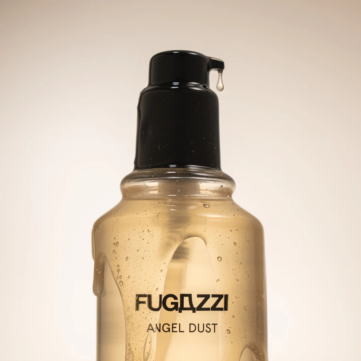Fugazzi angel dust body wash close up of bottle with a drop coming out of the pump.